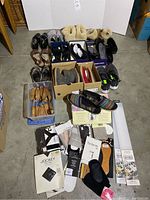 Overview photo showing entire assortment of shoes, hosiery packages, cedar shoe forms, and drawer organizers laid out.