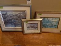 Three Keirstead prints framed and displayed, various sizes including 10x13.5, 7x10, and 5x7 inches, depicting a seaside scene, lake scene, and snowy landscape.