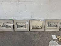 Four matted black and white architectural prints with metal frames, arranged against a wall, showing the overall lot