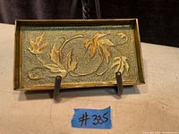 Top down view showing embossed maple leaf design and textured background
