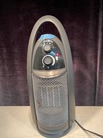 Front view of the Sunbeam electric heater showing overall shape, control panel and power cord.