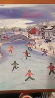 Cover showing a winter scene with people ice skating on a frozen river, stone bridge, trees, and houses in a painting style.
