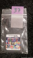 Nintendo DS Tetris game cartridge in a plastic bag with label showing colorful Tetris DS logo.