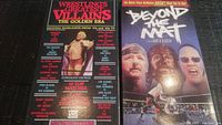 Two WWF wrestling VHS tapes side by side: 'Wrestling's Greatest Villains - The Golden Era' and 'Beyond the Mat'