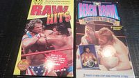 Lot of two WWF wrestling VHS tapes showing front covers, one titled 'Raw Hits' and the other 'Beach Brawl'