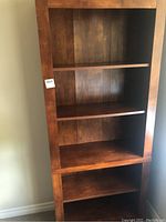Front view of 5-shelf brown bookcase