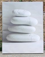 Photo of a 16 x 19 inch picture showing four white stones stacked on top of each other, unframed.