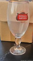 Single Stella Artois glass showing logo and shape
