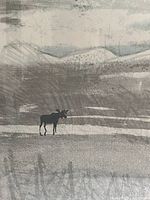Close-up of the moose figure and surrounding landscape print