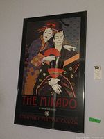 Full view of the larger framed print of The Mikado from Stratford Festival Canada, showing two characters with fans.