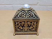 Front view of Edgar Berebi ornate decorative ring jewelry trinket box with faux pearl on top