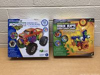 Photo of two boxed Techno Gear construction toy sets: Monster Truck (60+ pieces) and Swarming Bug (80+ pieces)