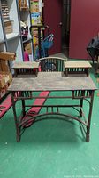 Full view of antique wicker and rattan desk showing main work surface with raised shelves, and tubular rattan frame.