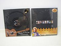 Front of 2007 and 2008 albums in slipcases side by side