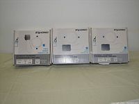 Three boxed LED downlights. One box is slightly damaged.