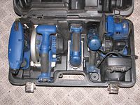 Delta ShopMaster cordless power tool set arranged in molded carrying case showing all 7 tools.