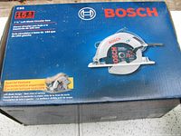 View of the box front showing brand, model, blade size, amp rating and left blade design.