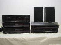 Front view of all stacked components and speakers