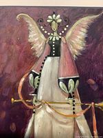 Close-up showing the upper portion of the female fairy figure with wings and trumpet in hand.