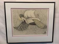 Framed pen and ink hand colored artwork with visible matting and signature.