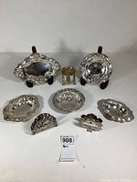 Group view of all eight sterling silver pieces