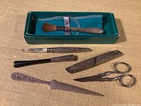 Overview of all 6 items including two Towle brushes, Cross scissors, V.N. cigarette holder, S. Kirk & Son letter opener, Tiffany seam ripper