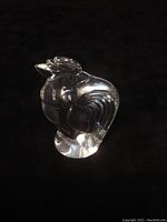 Front side view of clear crystal rooster hand warmer showing rooster's head and body contours