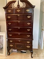 Full front view of cherry highboy showing all seven drawers and overall condition