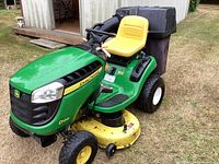 Front and side view of mower showing hood, seat and deck