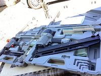 Two Porter Cable pneumatic framing nailers in molded gray plastic cases with accompanying nails, stapler staples box, Allen wrenches, oil bottle, and instruction manual.