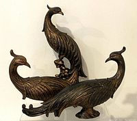 Front view of the three Syroco copper pheasant figurines on display.
