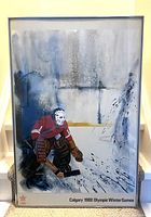 Photo of framed signed print showing hockey goalie in red and brown gear on ice, with text Calgary 1988 Olympic Winter Games on lower border.