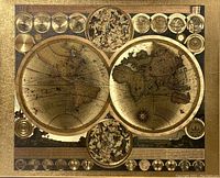 Close detail of eastern hemisphere map circle and adjacent celestial chart with gold foil highlights.