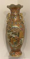 Full view of the vintage Japanese Satsuma Moriage floor vase showing front decorative details and flared rim.