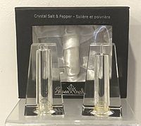Photo showing pair of sealed-In-Box vintage Rosenthal crystal salt and pepper shakers with trapezoidal clear crystal shape.