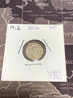 Front (obverse) side of 1912 Newfoundland 5 cents silver coin showing detailed engraving and inscription.