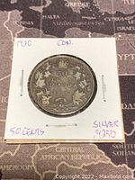 Obverse side showing denomination and maple leaves with crown.