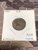Reverse side of the 1920 Great Britain 6 Pence silver coin showing crowned lion emblem and purity markings.