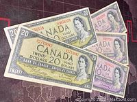 Three $20 and three $10 front faces overlapping