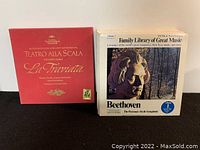 Photo showing Teatro Alla Scala La Traviata red box album and stack of white cover Family Library of Great Music albums including Beethoven