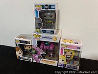 All four boxed Funko Pop figures displayed together
