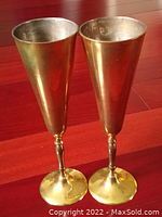 Pair of solid brass wine cups standing side by side, showing height and front view.