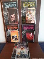 Five Clive Barker's Hellraiser hardcover graphic novels arranged in a collage with visible cover art and title, showing overall condition and color schemes.
