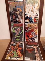 Six Batman & Robin comic books laid out in two columns with colorful 1990s animated series style covers.