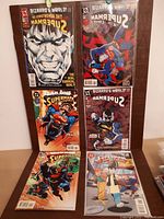 Photo of six Superman comic books from 1990s including Bizarro's World series