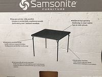 Box label showing Samsonite Furniture branding and product description including features such as fully assembled, reinforced vinyl upholstery, and sturdy steel frame.