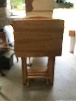 Blurred photo of the trays and stand with focus on the stacked trays and stand structure.