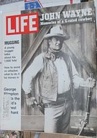 Cover of January 1972 Life magazine featuring John Wayne in cowboy attire with rifle.