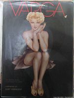 Front cover of the hardcover book showing a painted blonde Varga Girl on black background with title in red text.