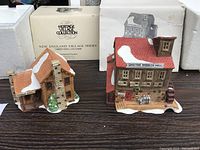 Photo of Timber Knoll Log Cabin and Smythe Woolen Mill miniature buildings with original boxes and styrofoam packaging visible behind them.